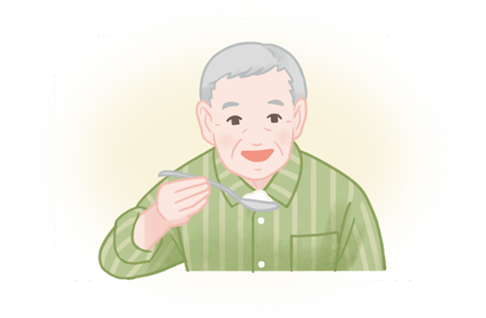 5期モデルの１、先行期。高齢者がスプーンで食物を口に運ぶ。